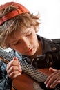 Kid learning to play guitar Royalty Free Stock Photo