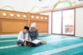 Kid learning to read quran Royalty Free Stock Photo