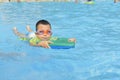 Kid learning to swim in summer Royalty Free Stock Photo