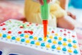 Kid learning to use screwdriver. Multicolor screws. Future occupation concept Royalty Free Stock Photo