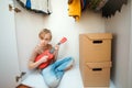 Kid learns to play ukulele at home. Talented kid enjoy music. People, leisure and lifestyle
