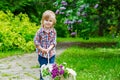 Kid with lilac blossoms