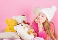 Kid little girl play with soft toy teddy bear pink background. Bears toys collection. Teddy bears improve psychological