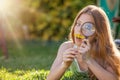 Kid looking magnifying glass