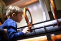 Kid looking through magnifying glass system