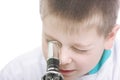 Kid looking into microscope closeup