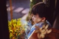 Kid looking out window. Portraits of people thinking. Royalty Free Stock Photo