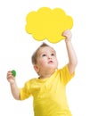 Kid looking up with blank yellow cloud in hand Royalty Free Stock Photo