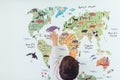 kid looking world map. High quality photo