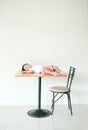 Kid lying on wrong place. Somebody put baby boy on the dining table
