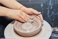 Modeling of clay on a potter`s wheel In the pottery workshop