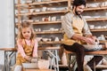 kid making ceramic pot on pottery wheel with teacher Royalty Free Stock Photo