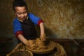 Kid making pottery