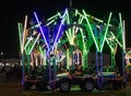 kid merry go round swing at night with colorful light at city fair ground from different angle Royalty Free Stock Photo