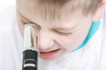 Kid with microscope closeup