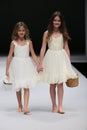 Kid models walk runway at Ivy and Aster fashion show during Fall 2015 Bridal Collection Royalty Free Stock Photo