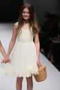 Kid models walk runway at Ivy and Aster fashion show during Fall 2015 Bridal Collection Royalty Free Stock Photo