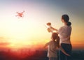 Kid and mom playing with drone Royalty Free Stock Photo