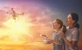 Kid and mom playing with drone Royalty Free Stock Photo