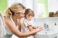 Kid with mom washing hands Royalty Free Stock Photo