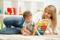 Kid and mother playing with abacus Royalty Free Stock Photo