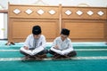 Kid muslim reading quran