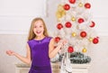 Kid near christmas tree hold skates gift. Little girl satisfied christmas gift. Best gift ever. Happy new year concept Royalty Free Stock Photo