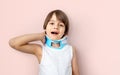 Kid accusing neck pain and wearing a cervical collar brace Royalty Free Stock Photo