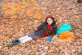 kid with notebook. fall season fashion. teen girl in school uniform hold autumn leaves. Royalty Free Stock Photo