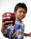 Kid offering apple Royalty Free Stock Photo