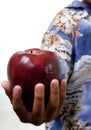 Kid offering apple Royalty Free Stock Photo