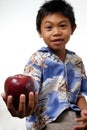 Kid offering apple Royalty Free Stock Photo