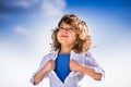 Kid opening his shirt like a superhero Royalty Free Stock Photo