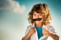 Kid opening his shirt like a superhero Royalty Free Stock Photo