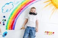 Kid painting rainbow