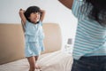 Kid pillow fight on the bed Royalty Free Stock Photo