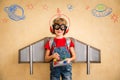 Kid pilot with toy jetpack playing at home Royalty Free Stock Photo