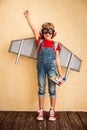 Kid pilot with toy jetpack playing at home Royalty Free Stock Photo