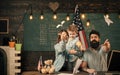 Kid play. American family at desk with son making paper planes. Homeschooling concept. Parents teaching son american Royalty Free Stock Photo