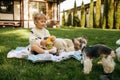 Kid play with teddy bear in the garden Royalty Free Stock Photo