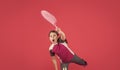 kid playe tennis with racket on pink background