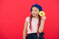 Kid playful girl ready to eat donut. Sweets shop and bakery concept. Kids huge fans of baked donuts. Impossible to Royalty Free Stock Photo