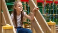 Kid on playground. little girl play outdoor on school yard slide. Healthy activity. Child playing in sunny park. Kid having fun on Royalty Free Stock Photo