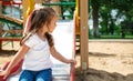 Kid on playground. little girl play outdoor on school yard slide. Healthy activity. Child playing in sunny park. Kid having fun on Royalty Free Stock Photo