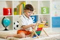 Kid playing with abacus Royalty Free Stock Photo