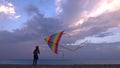 Kid Playing on Beach on Seashore, Child Flying Kite at Sunset on Ocean, Girl on Coastline in Summer Vacation Sea Waves at Sundown Royalty Free Stock Photo