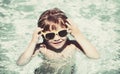 Kid playing on the beach on summer holidays. Child in nature with beautiful sea, sand and blue sky. Happy kids on Royalty Free Stock Photo