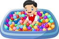 Kid playing with colored balls in the bath Royalty Free Stock Photo