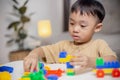 The kid playing with colorful toy blocks. Little boy building the car of block toys. Educational and creative toys and games for Royalty Free Stock Photo