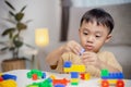 The kid playing with colorful toy blocks. Little boy building the car of block toys. Educational and creative toys and games for Royalty Free Stock Photo